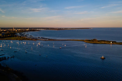 High angle view of sea against sky during sunset