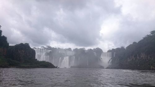 Panoramic shot of waterfall against sky