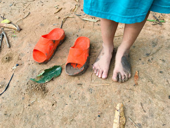 Low section of woman standing on tiled floor