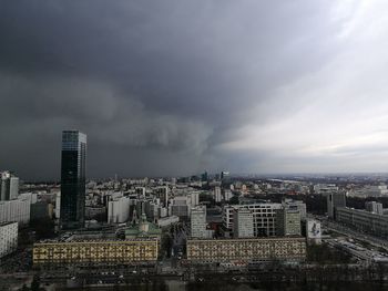 Cityscape against cloudy sky