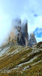 Rock formations on landscape against sky