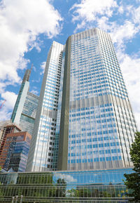 Low angle view of modern buildings against sky