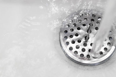 High angle view of water falling in sink