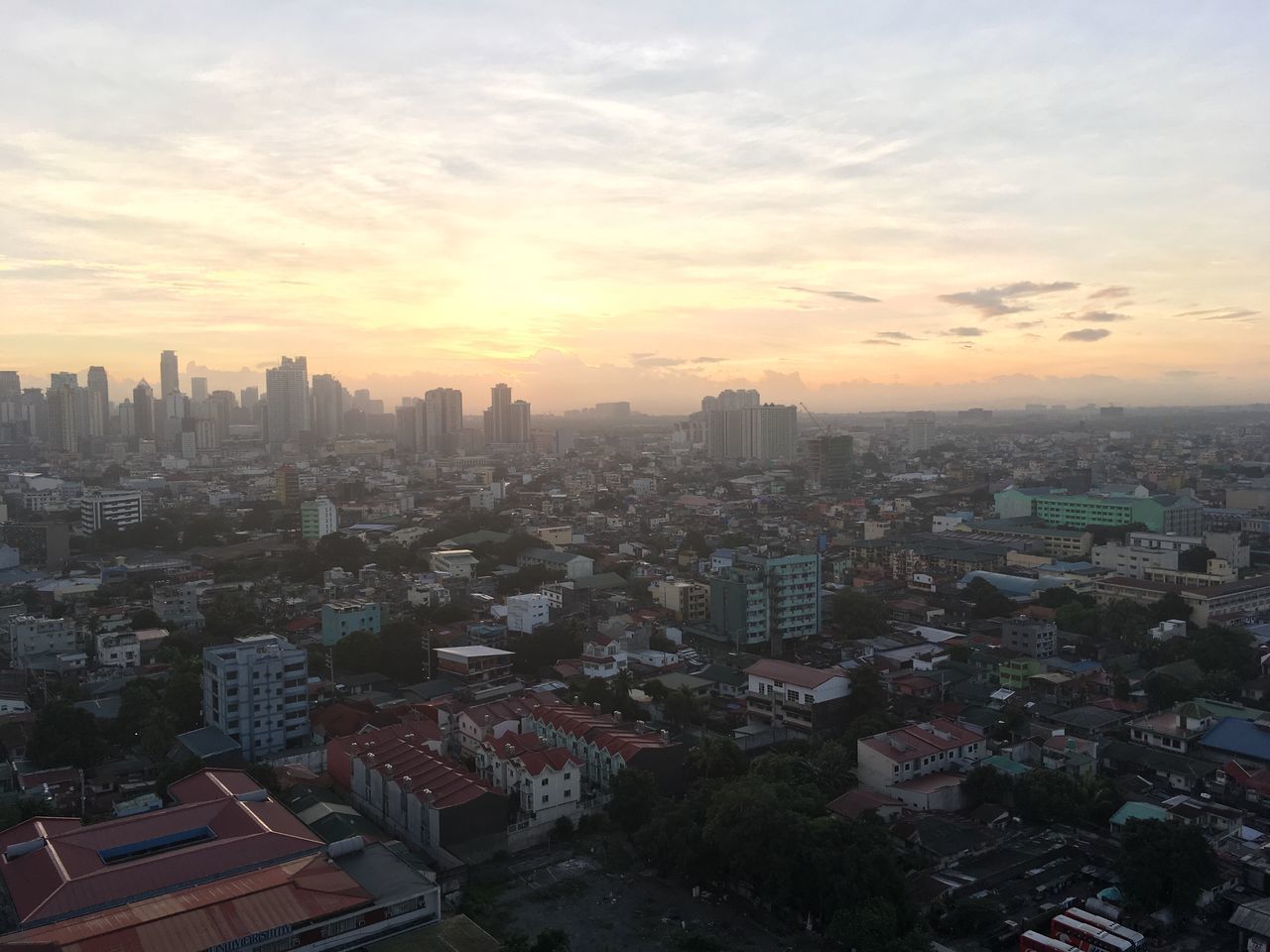 CITYSCAPE AGAINST SKY AT SUNSET