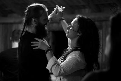 Side view of couple dancing during party