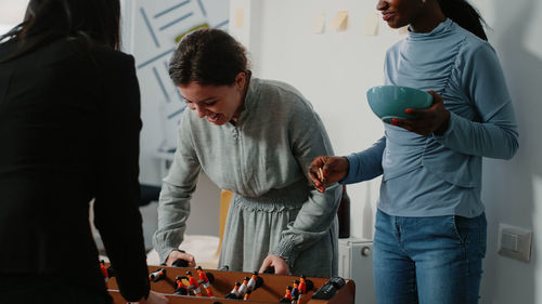 Side view of business colleagues working at office