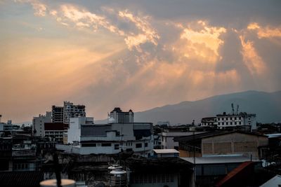 High angle view of buildings against sky at sunset