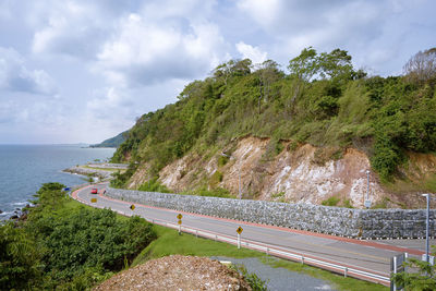 Road by sea against sky