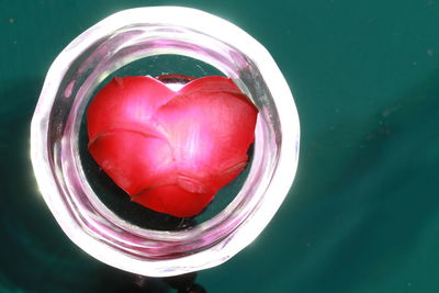 High angle view of fruit in glass container on table