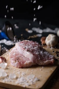 Close-up of meat on cutting board