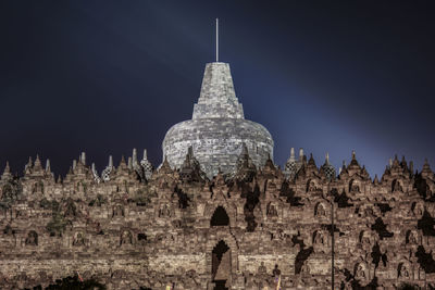 View of temple against building