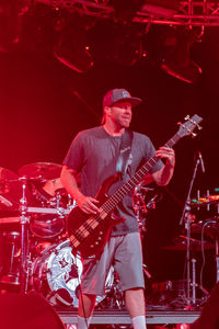 Man playing guitar at music concert