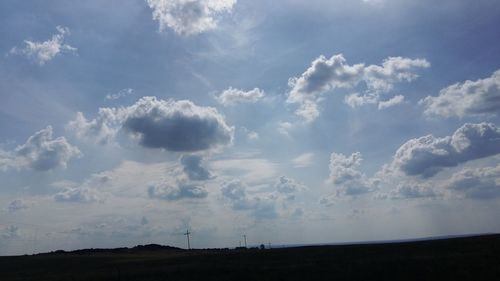 Scenic view of landscape against cloudy sky