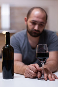 Portrait of man holding wineglass