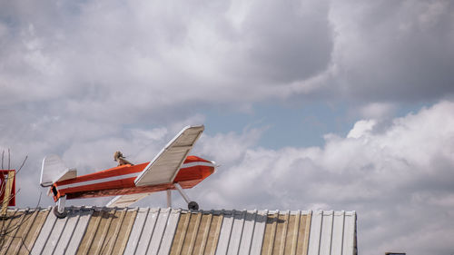 Low angle view of airplane against sky