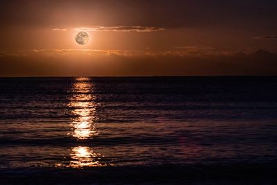 Scenic view of sea against sky at sunset