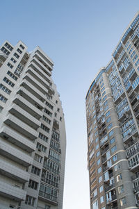 Low angle view of modern buildings against sky