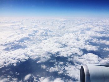 Cropped image of airplane over landscape