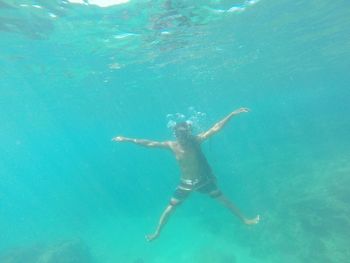 Young woman swimming in sea