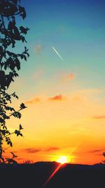 Scenic view of silhouette landscape against sky at sunset