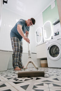Side view of man working at home