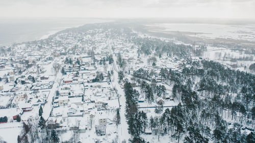 Aerial view of buildings in city during winter