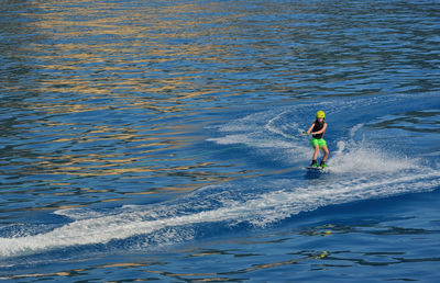 High angle view of boy water skiing