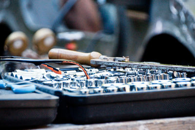 Close-up of tools on table at auto repair shop