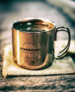 Close-up of coffee cup on table