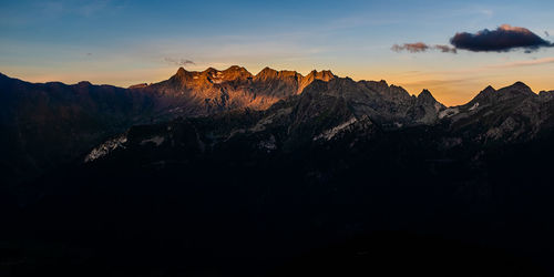 Scenic view of mountains against sky during sunset