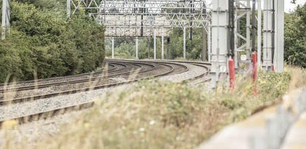  outdoor diminishing perspective view of curve railway track lines without train 