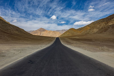 Empty road passing through a desert