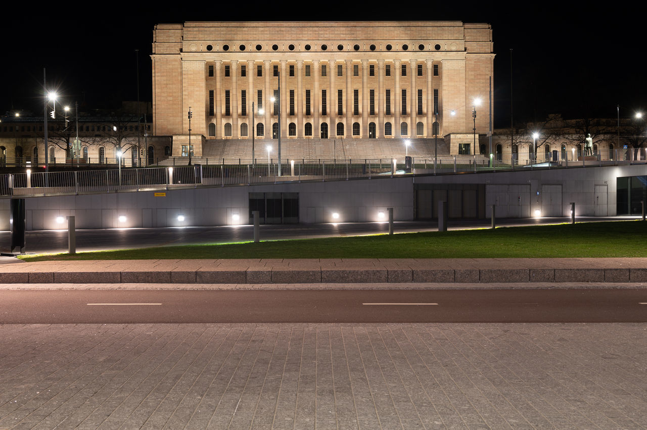 VIEW OF ILLUMINATED STREET AT NIGHT