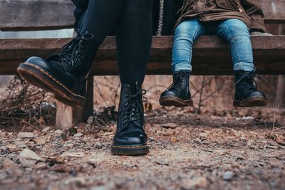 Mother and child sitting outdoors