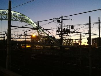 Railroad tracks against sky during sunset