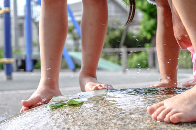 Low section of people standing in water