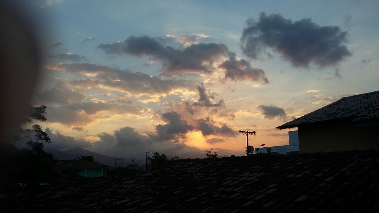 DRAMATIC SKY OVER CITY DURING SUNSET