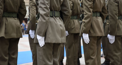 Rear view of people standing outdoors