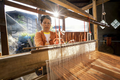 Woman with loom