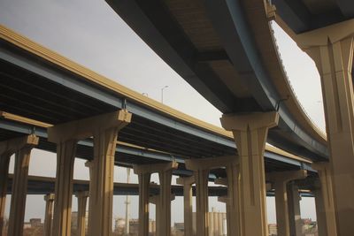 Low angle view of elevated road against sky