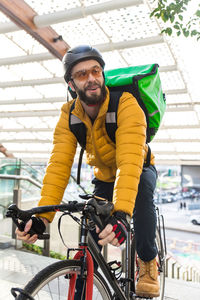 Portrait of man riding bicycle