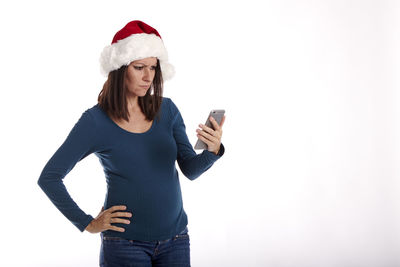 Full length of a young woman using mobile phone