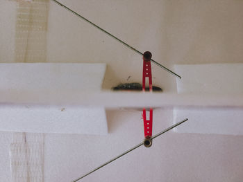 Close-up of electric lamp hanging on wall