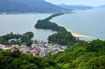 High angle view of buildings by sea