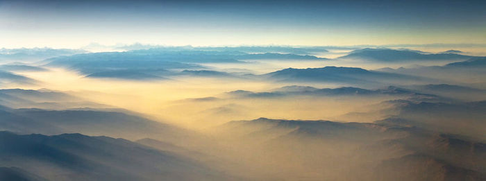 Scenic view of mountains against sky at morning