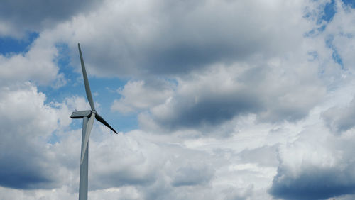 Low angle view of wind turbine against sky