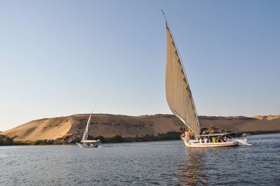 Boat in sea against clear sky