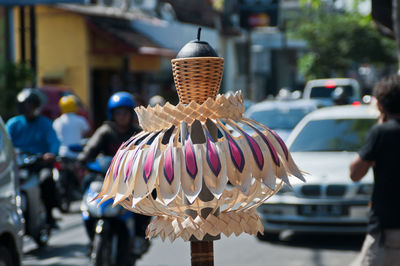 Figurine in front of traffic in bali