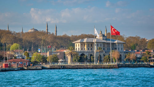 View of buildings against cloudy sky