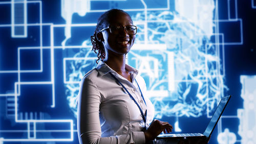 Portrait of woman using mobile phone